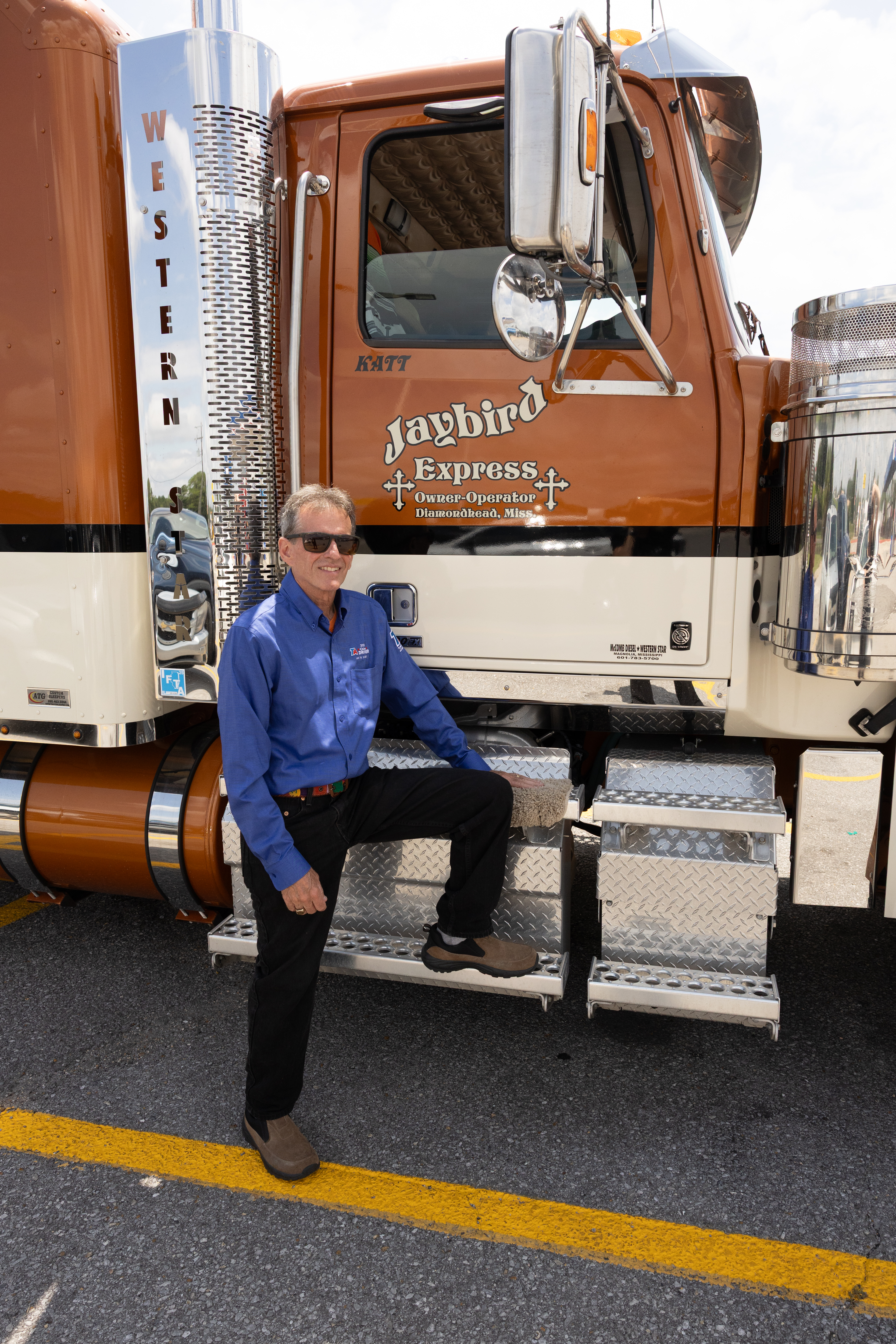 2025 TA Citizen Driver Of The Year and Landstar Roadstar Jay Hosty standing in front of his truck.
